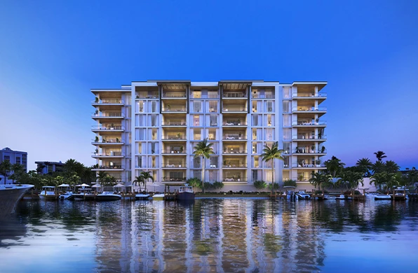3300 Gulf Shore waterfront residence at dusk with marina boats and palm tree