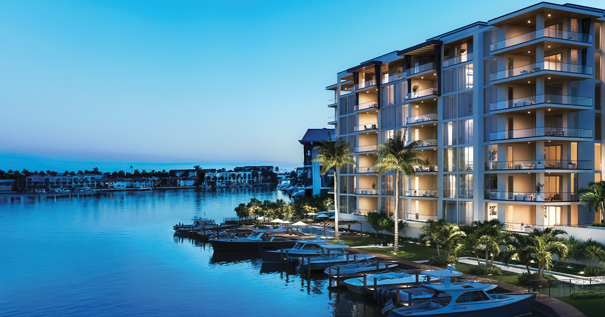 Angled marina view of luxury waterfront residences with boats at dusk