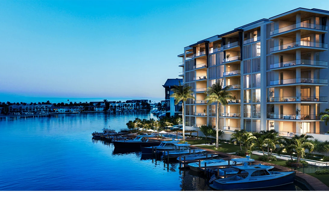 3300 Gulf Shore waterfront residence at dusk overlooking marina boats and blue water