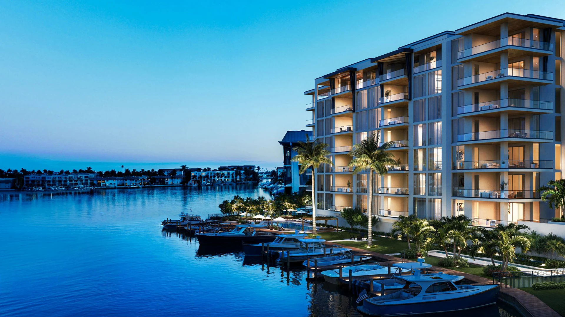 3300 Gulf Shore waterfront residence at dusk overlooking marina boats and blue water